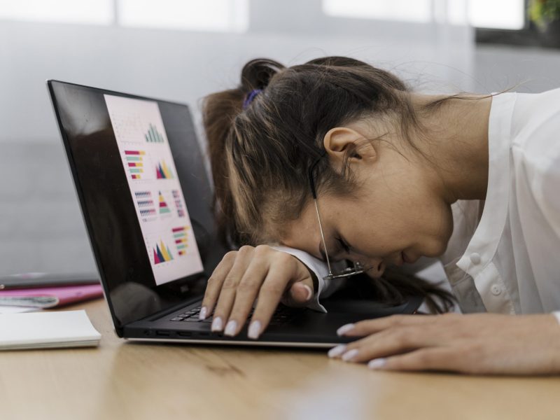 woman-resting-her-head-laptop